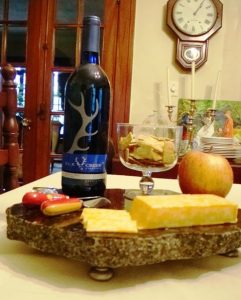 Granite remnant serving tray with wine and cheese